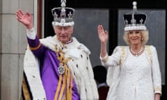 King Charles III and Queen Camilla wave to the crowds from the balcony of Buckingham Palace after the coronation ceremony in London, Saturday, May 6 2023.