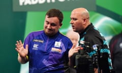Luke Littler celebrates his emphatic victory over Rob Cross at Alexandra Palace