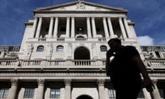 A person walks past the Bank of England