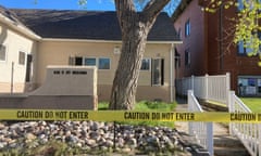 A plain building with police tape in front of it.