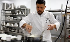 Charles Guilloy cooking a kitchen.