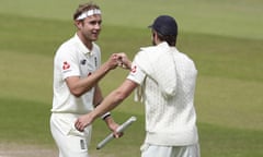 Stuart Broad bumps fists with Chris Woakes.