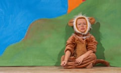 A girl in a lion costume.