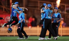 The Strikers celebrate victory in the Women's Big Bash League final against the Sydney Sixers at North Sydney Oval.