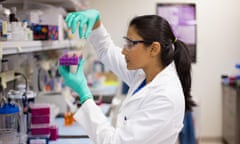 Closeup portrait, young scientist in labcoat doing experiments in lab, academic sector.<br>EKMA44 Closeup portrait, young scientist in labcoat doing experiments in lab, academic sector.