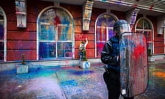 A protester write on the facade of the Ministry of Justice building with color spray during an anti-government protest in Skopje on May 20, 2016, in a series of protests dubbed Colourful Revolution. Crisis-hit Macedonia postponed elections due next month, after the European Union called on Skopje to delay the polls to ensure they could take place freely and fairly. / AFP PHOTO / Robert ATANASOVSKIROBERT ATANASOVSKI/AFP/Getty Images