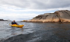 Kevin Rushby and son in Sweden kayaking Niall in kayak