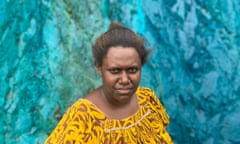 Theonila Roka Matbob, the newly-elected member for Ioro, standing in the pit of the Panguna mine where polluted water has discoloured the land and river beds.