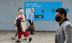 People wearing masks while shopping in the city centre in Preston.