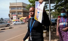 Hajarah Nikitto holds up a picture of her dead son, Amos Ssegaw