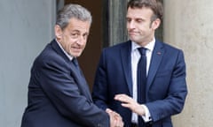 Nicolas Sarkozy and Emmanuel Macron shake hands