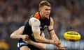 Patrick Cripps handpasses the ball during the 2024 AFL match between the Carlton and Geelong