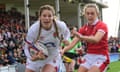 Jess Breach of England goes past Hannah Jones of Wales to score a try in the corner