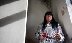 Michelle Bromley speaks while standing beneath a patch of mould in her rented house