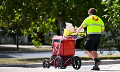 Mail is delivered by an Australia Post employee 