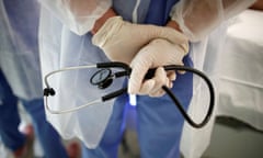 A doctor holds a stethoscope in the Intensive Care Unit (ICU) at the Melun-Senart hospital, near Paris, France, October 30, 2020.