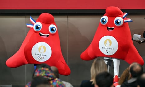 ‘Clitoris in trainers’: Paris Olympic mascots likened to feminist inflatable – video