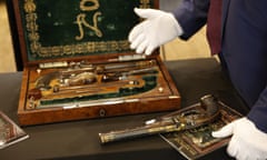 This photograph shows a box containing two pistols, which belonged to Emperor Napoleon I, during the preview before their auction, in Paris on 18 June 2024. The sale, called “L'Empire à Fontainebleau”, organised by both Rossini and Osenat auction houses, will take place on 7 July 2024 in Fontainebleau