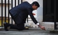 Rishi Sunak lights the oil lamps for Diwali outside his Downing Street residence.