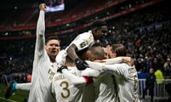 Lyon players celebrate Alexandre Lacazette's winner against Nantes on 20 December 2023.