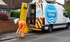 A photo of a Thames Water employee working in Windsor fixing leaking pipes in July 2023.