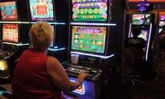 Gamblers playing poker machines, known as pokies.