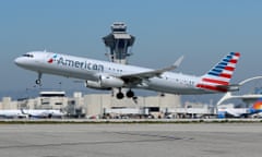 An American Airlines flight takes off at LAX