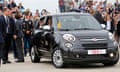 Pope Francis waves as he is driven away in a Fiat 500 model after arriving in the United States at Joint Base Andrews outside Washington September 22, 2015.    REUTERS/Jonathan Ernst