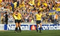 Malcolm Shotton. left, congratulates Jeremy Charles on  Oxford United’s third goal against QPR in the 1986 League Cup final, as Kevin Brock celebrates