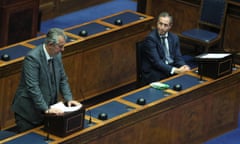 Edwin Poots, who has resigned as DUP leader, with the new first minister of Northern Ireland, Paul Givan, at a special sitting of the Stormont assembly.
