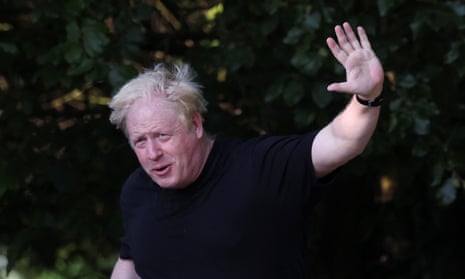 Boris Johnson gestures while out running near his home in Brightwell-cum-Sotwell, Oxfordshire