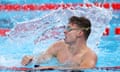 Leon Marchand of France celebrates after winning gold in the men's 200m breaststroke final, his second gold of the night, and his third of the games.