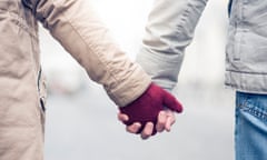 Shot of a young couple holding hands.