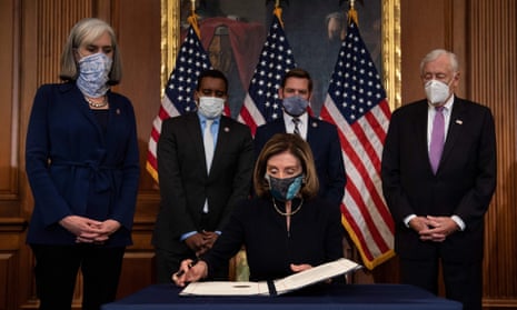 US-POLITICS-CONGRESS-IMPEACHMENT-VOTE<br>Speaker of the House Nancy Pelosi (D-CA), waits to sign the article of impeachment, alongside impeachment managers, during an engrossment ceremony after the US House of Representatives voted to impeach the US President Donald Trump at the US Capitol, January 13, 2021, in Washington, DC. - Donald Trump on January 13 became the first US president to be impeached for a second time, when a bipartisan majority in the House of Representatives voted to charge him with inciting last week's attack on the US Capitol. (Photo by Brendan Smialowski / AFP) (Photo by BRENDAN SMIALOWSKI/AFP via Getty Images)