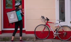 A young woman working in the ‘gig economy’, for Deliveroo, the takeaway food delivery company.