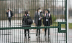 Pupils arrive at a school in in Manchester