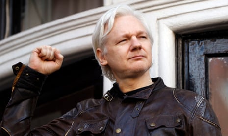 Julian Assange greets supporters from the balcony of the Ecuadorian embassy in London in 2017.