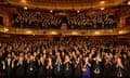 Audience applauding in theatre