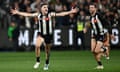 Brayden Maynard and Jeremy Howe celebrate as Collingwood Magpies hold on to the narrowest of leads against the GWS Giants to secure a spot in the AFL grand final.