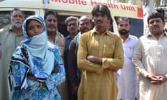 Relatives wait at a hospital to receive the bodies of victims killed at a Sufi shrine