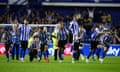 Sheffield Wednesday players gathered on the halfway line run to celebrate after beating Peterborough on penalties in the play-off semi-final to cap a dramatic comeback from a 4-0 first-leg defeat