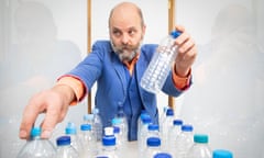 Gavin Turk with some of his salvaged water bottles.