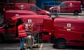 A Royal Mail worker loads vans at a delivery office in Tonbridge, Britain.