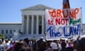 Protesters outside the US supreme court with a sign that reads 'Trump is not above the law'