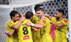 Wellington Phoenix players celebrate a goal