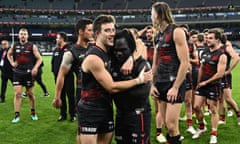 Best afield Zach Merrett and Anthony Mcdonald-Tipungwuti celebrate Essendon’s upset win over Richmond Tigers at the Melbourne Cricket Ground.