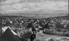 Palestinian refugees walk through Nahr el-Bared