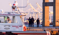 Baltimore bridge collapses after being hit by cargo ship<br>epa11246104 Rescue personnel gather on the shore of the Patapsco River after a container ship knocked down the Francis Scott Key Bridge in Baltimore, Maryland, USA, 26 March 2024. The Maryland Department of Transportation (MDOT) confirmed that the Francis Scott Key Bridge collapsed due to a ship strike on 26 March. Two people were rescued while at least six others were still missing, the MDOT Secretary said in a press conference, adding that they are believed to be members of a construction crew working on the bridge at the time of the incident. EPA/JIM LO SCALZO