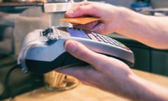 Close up of a hand using a contactless credit card terminal to pay<br>J9C0MH Close up of a hand using a contactless credit card terminal to pay