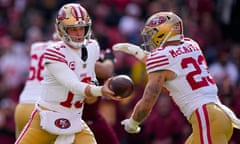 San Francisco 49ers quarterback Brock Purdy (13) hands the ball off to running back Christian McCaffrey (23) during the first half of Sunday’s game against the Washington Commanders.